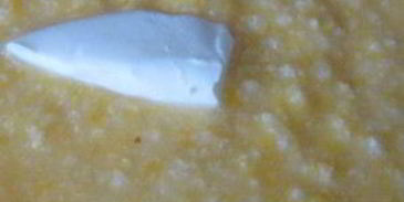 пшенная каша в чугунке